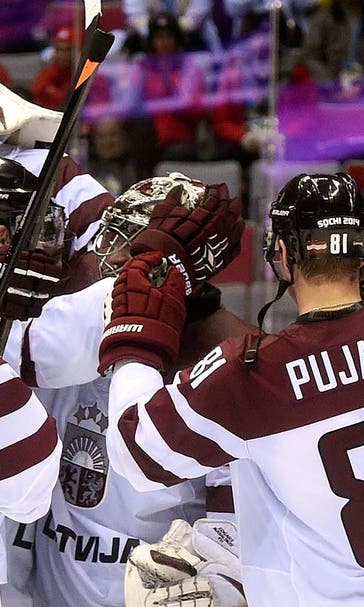 Latvia upsets Swiss, will face Canada in quarters